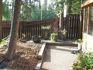 wood retaining wall, concrete patio, Yukon landscaping