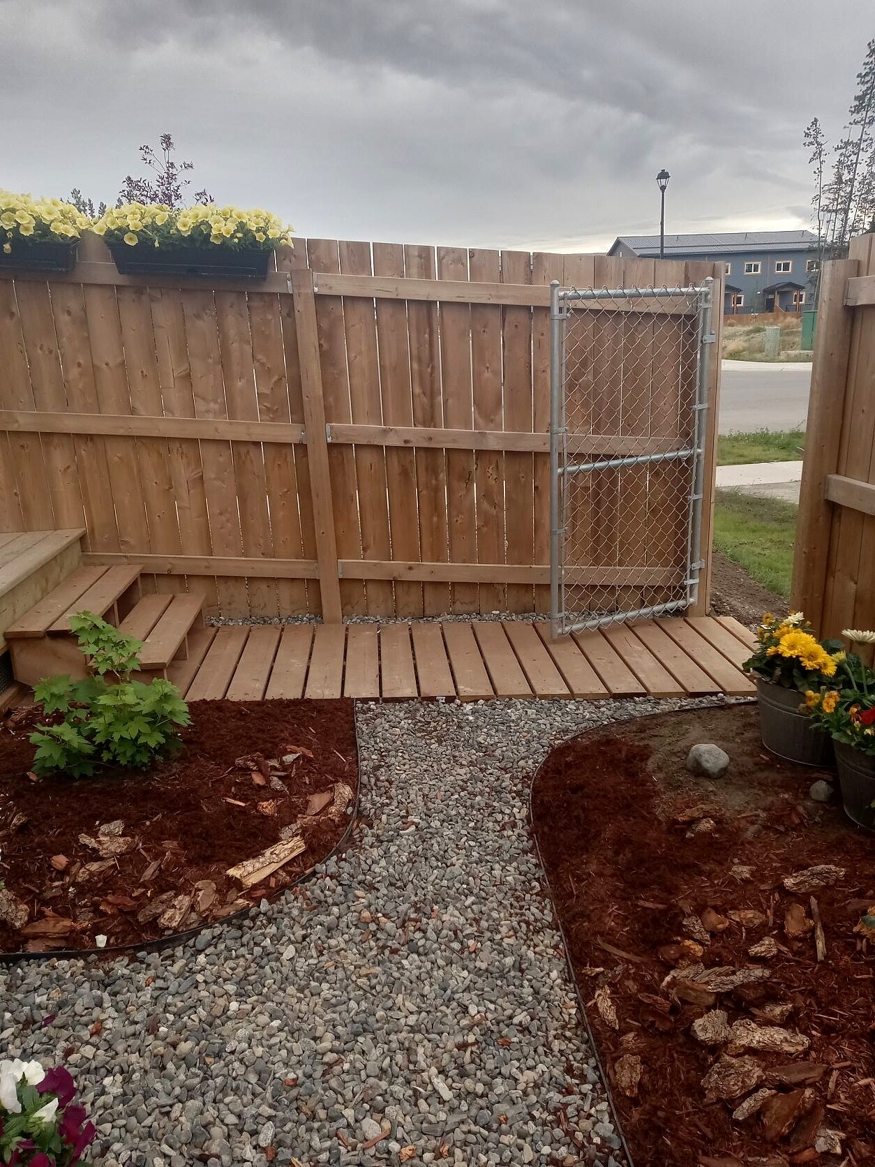 pressure-treated wood boardwalk shrubs and flowers